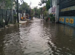 canal-amidst-buildings-city-monsoon-768x576